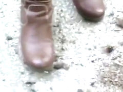 woman crush bugs boots