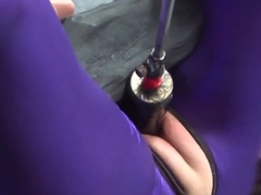 suspended in purple catsuit
