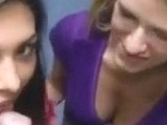 Two foxy college babes sucking cock in a store