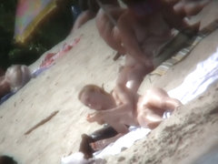 Beach voyeur vid of hippy blonde chick nude sunbathing