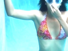 Bikini girl breathholding underwater